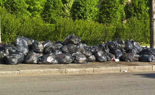 Workers segregating different types of construction waste